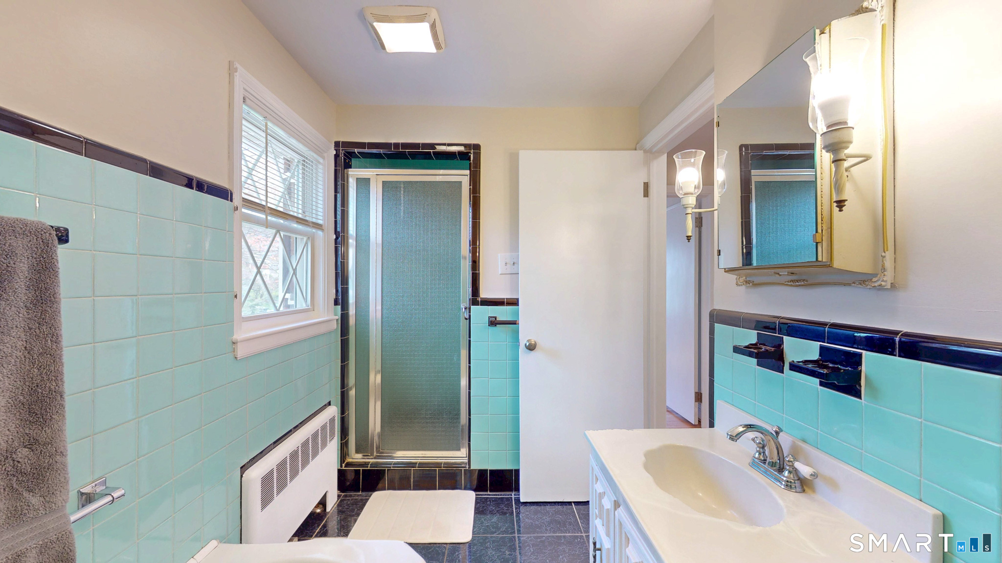 99 Sunset Ridge Drive East Hartford, CT 06118 - Photo 22 of 39 a bathroom with a sink a toilet and shower