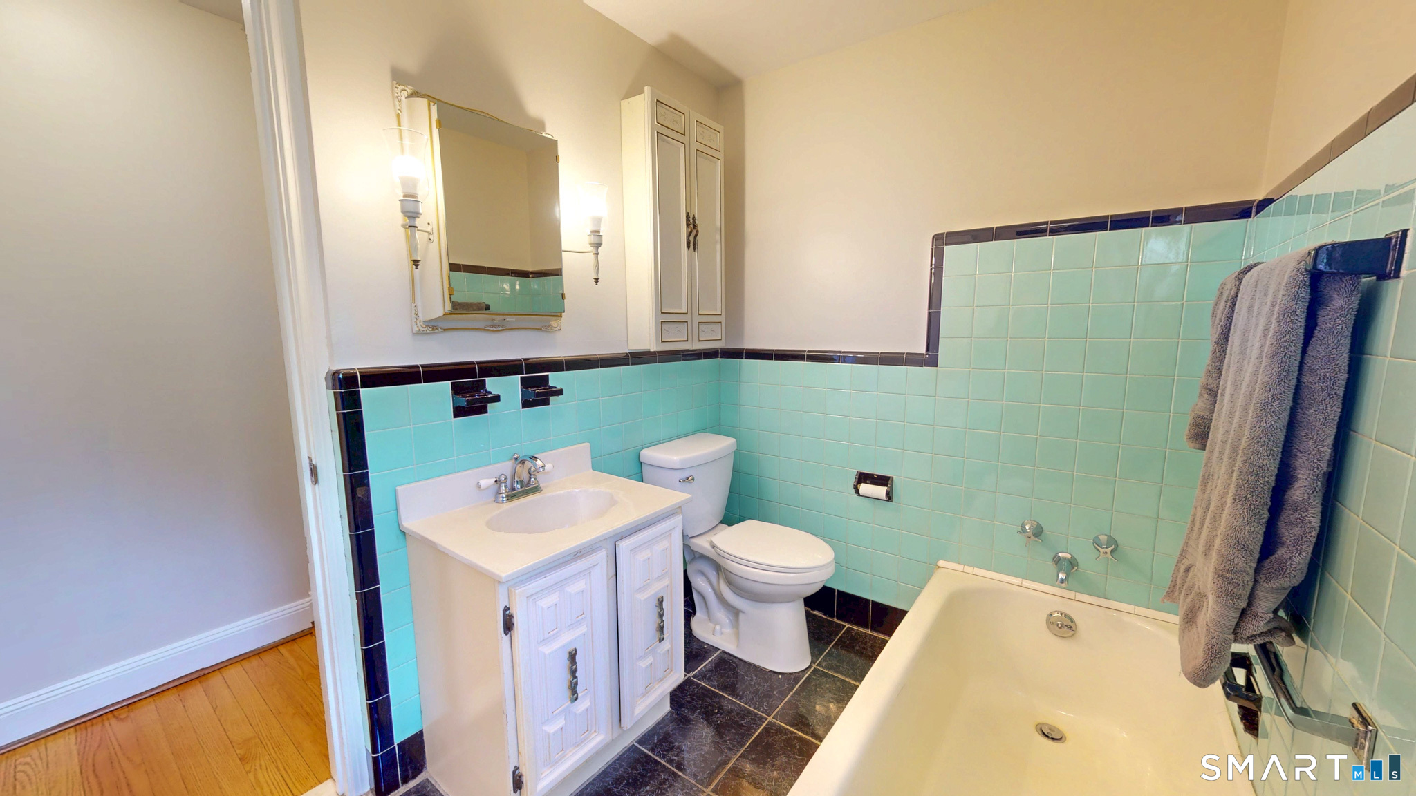 99 Sunset Ridge Drive East Hartford, CT 06118 - Photo 23 of 39 a bathroom with a sink toilet and mirror