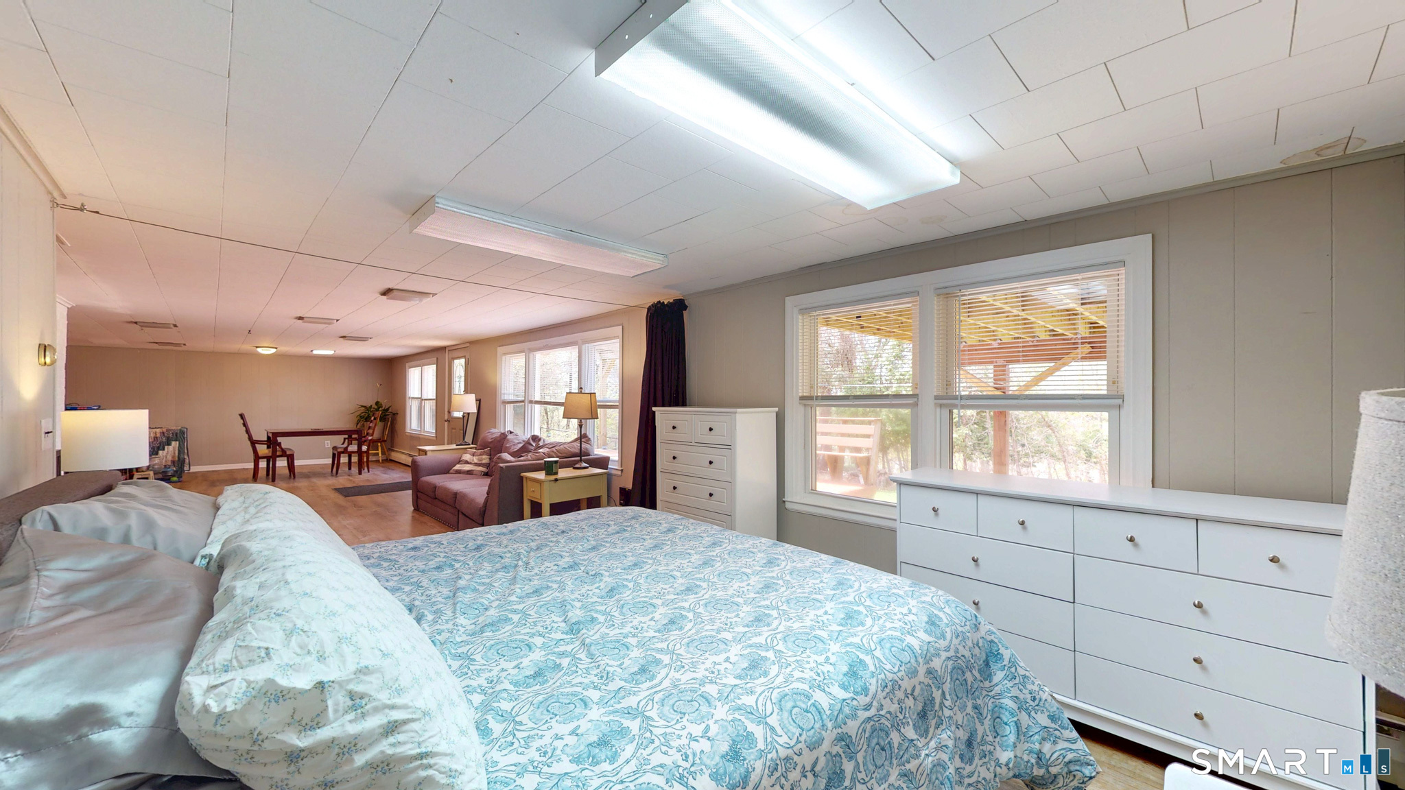 99 Sunset Ridge Drive East Hartford, CT 06118 - Photo 26 of 39 a large bedroom with furniture large window and flat screen tv