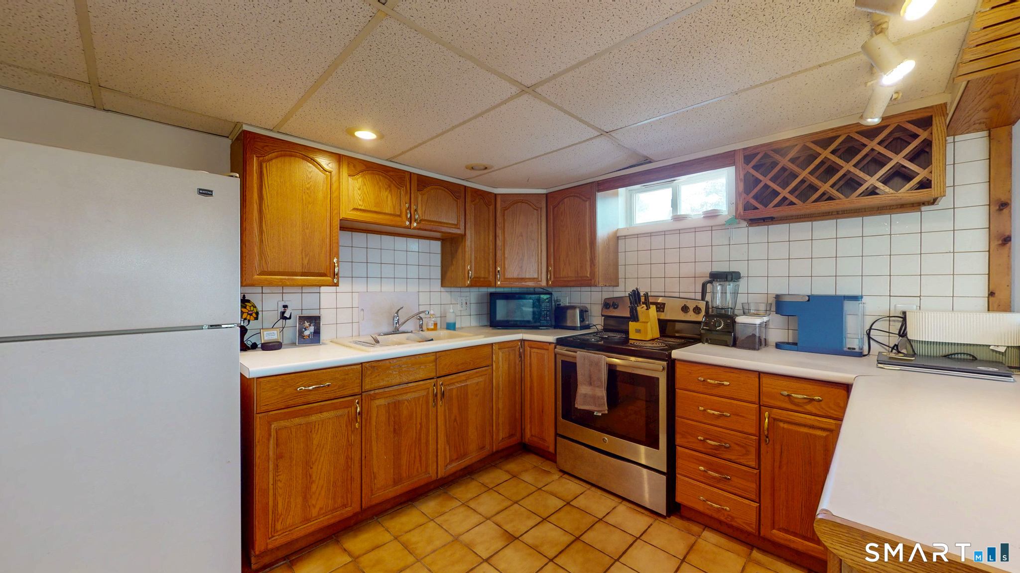 99 Sunset Ridge Drive East Hartford, CT 06118 - Photo 29 of 39 a kitchen with stainless steel appliances granite countertop a sink stove and refrigerator