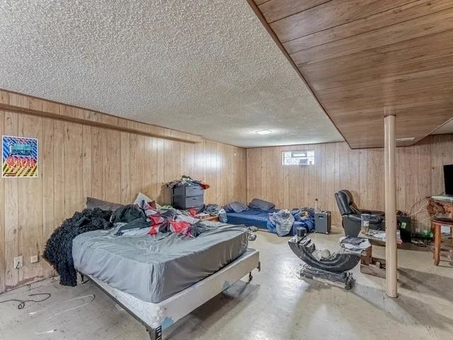 a bed room with a bed and a couch