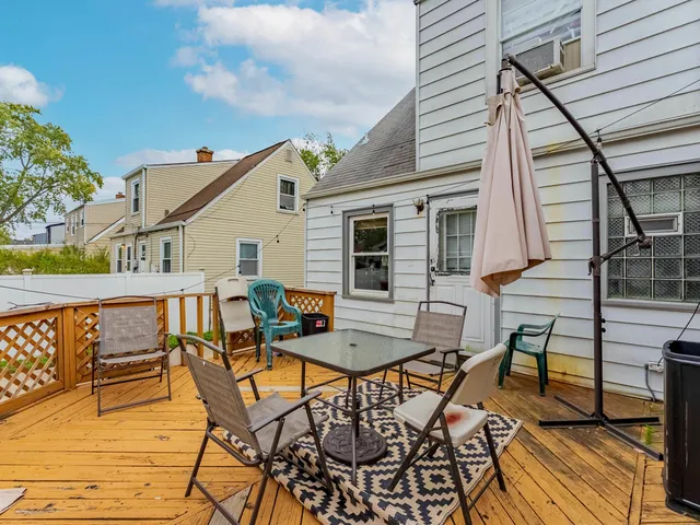 a view of a chairs and table on the deck
