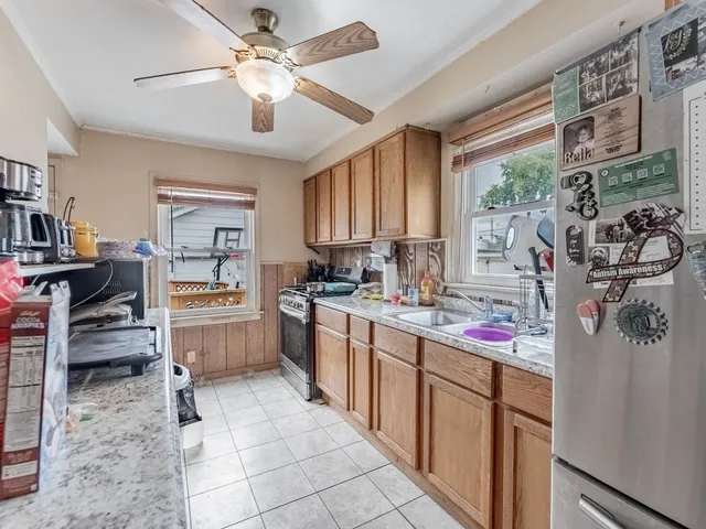 a kitchen with sink cabinets and window