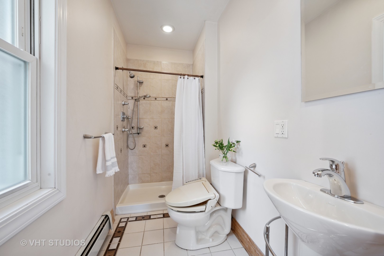 823 Jackson Avenue River Forest, IL 60305 - Photo 18 of 44 a bathroom with a toilet a sink and shower