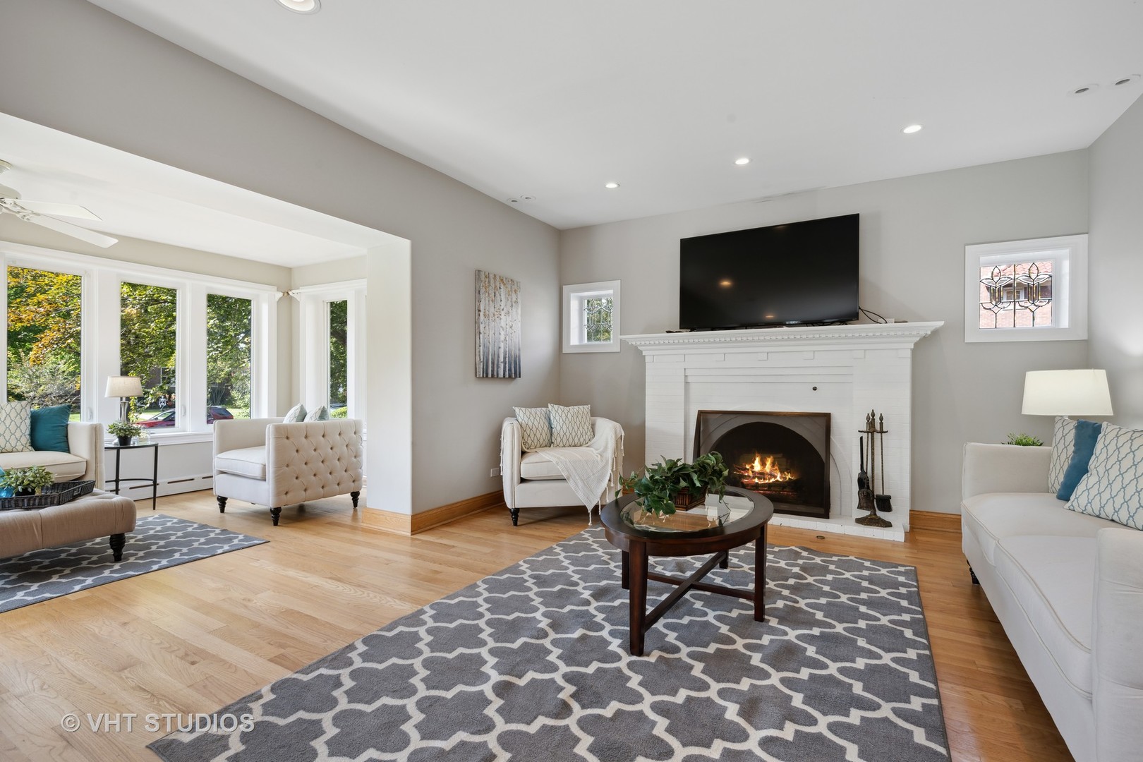 823 Jackson Avenue River Forest, IL 60305 - Photo 6 of 44 a living room with furniture a flat screen tv and a fireplace