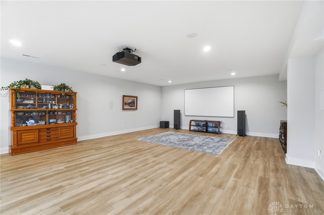 1247 Normandy Rue Dayton, OH 45458 - Photo 44 of 76 This versatile recreation room features recessed lighting and durable vinyl plank flooring, ideal for entertainment.