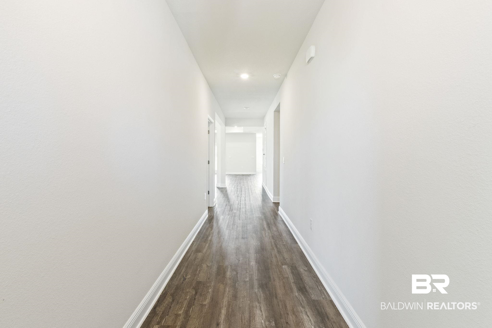 11303 Genuine Risk Circle Daphne, AL 36526 - Photo 10 of 100 Corridor featuring dark wood-type flooring
