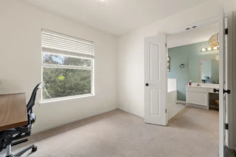 a view of a room with a window and a bathroom