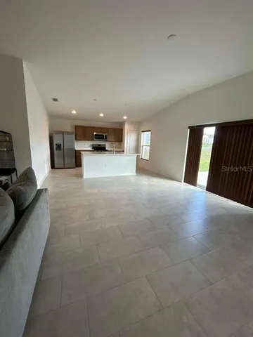 a view of a livingroom with furniture and window