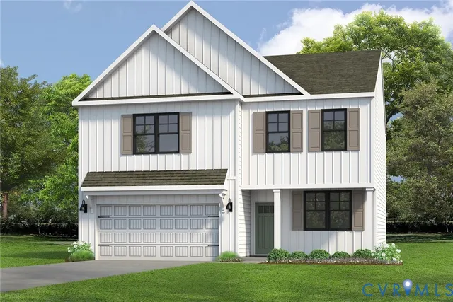 a view of a white house with a small yard and large trees