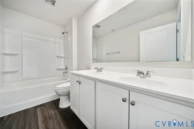 a bathroom with a sink a toilet and a bathtub