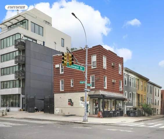 a view of a building with a street