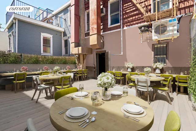 a living room with furniture and floor to ceiling windows