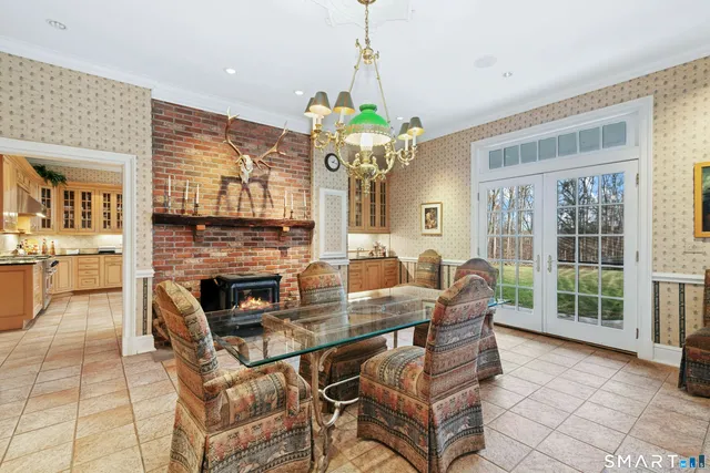 a view of a dining room with furniture wooden floor and chandelier