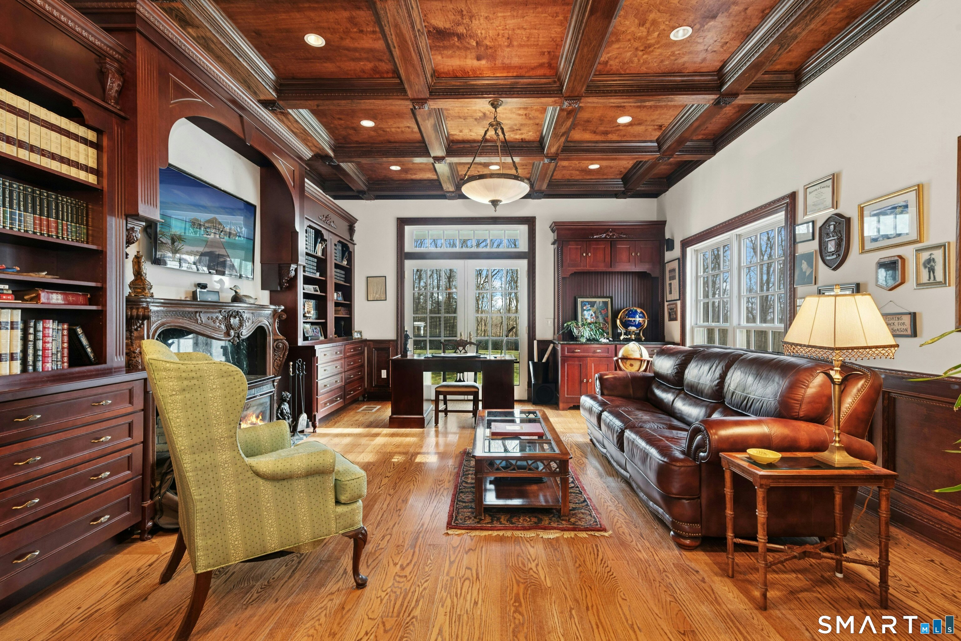 63 Turney Road Redding, CT 06896 - Photo 18 of 40 Office/Study w/richly hued built-ins, coffered ceiling and fireplace with wood stove