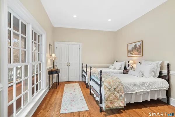 a bedroom with a bed and a window in it