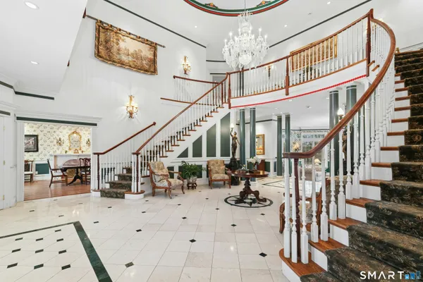 a view of entryway dining room and hall with wooden floor