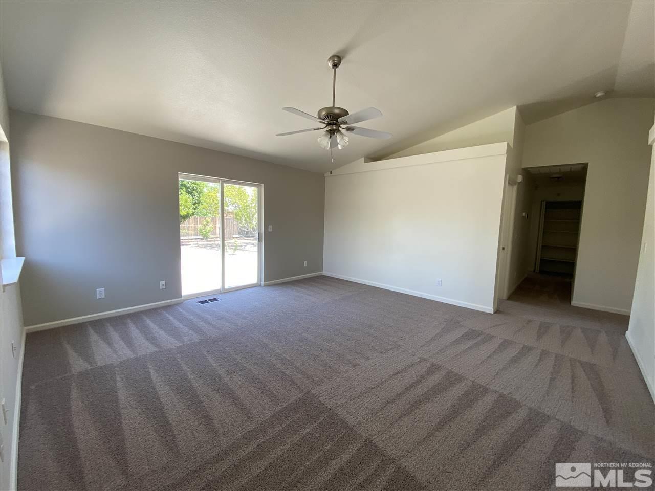 1200 Lattin Road Fallon, NV 89406 - Photo 8 of 19 an empty room with windows and fan
