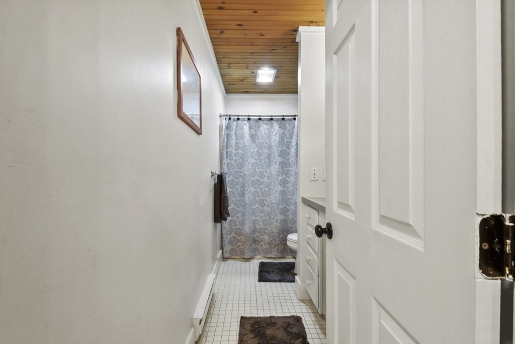 976 Plain Street, Unit 48 Marshfield, MA 02050 - Photo 13 of 20 a bathroom with a sink and a shower