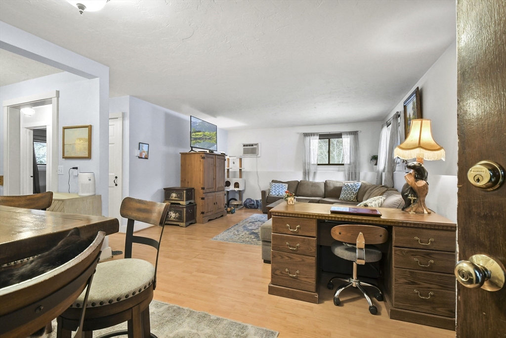 976 Plain Street, Unit 48 Marshfield, MA 02050 - Photo 7 of 20 a view of a workspace with furniture and a window