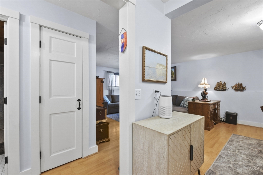 976 Plain Street, Unit 48 Marshfield, MA 02050 - Photo 8 of 20 a living room with furniture and wooden floor