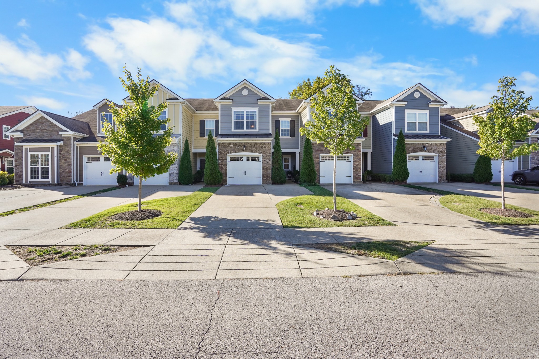 a view of a house with swimming pool and a yard