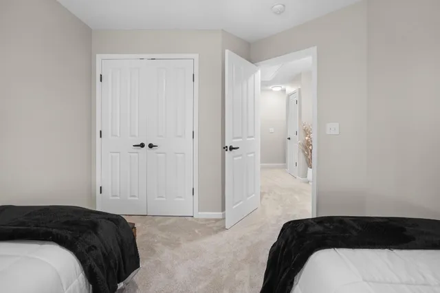 a bedroom with a bed and a shower