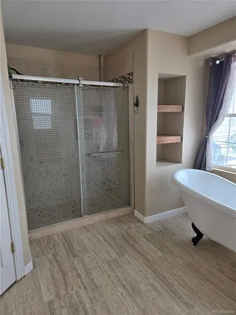 a bathroom with a shower and a toilet