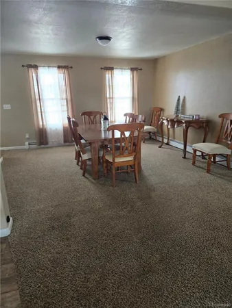 a view of a livingroom and dining room