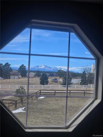 a view of staircase with white walls