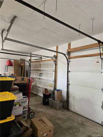 en empty room with windows and entrance