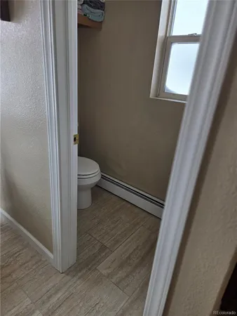 a view of a bathroom from a hallway