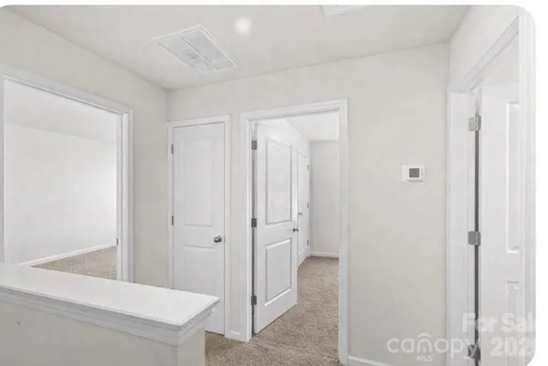 a view of bathroom with a sink mirror and shower
