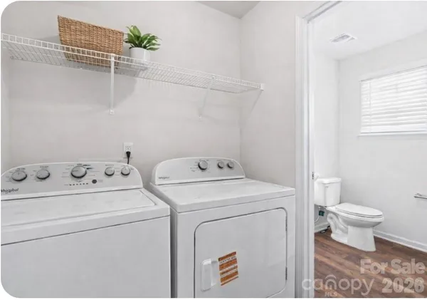 a view of bathroom with a washer and dryer