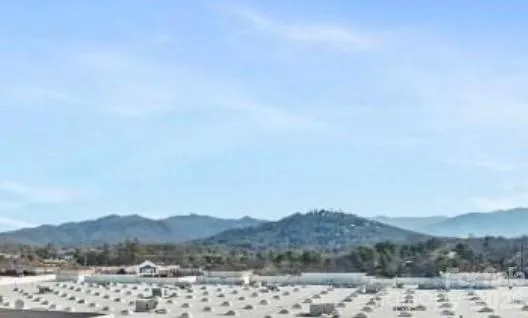 a view of mountain and tree