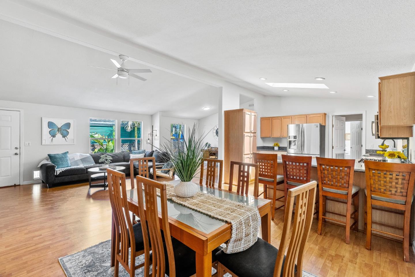 2155 Wharf Road, Unit 9 Capitola, CA 95010 - Photo 13 of 27 a living room with furniture dining table and a large window