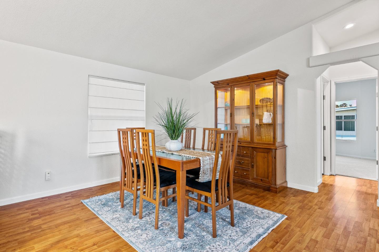 2155 Wharf Road, Unit 9 Capitola, CA 95010 - Photo 14 of 27 a dining room with furniture and wooden floor