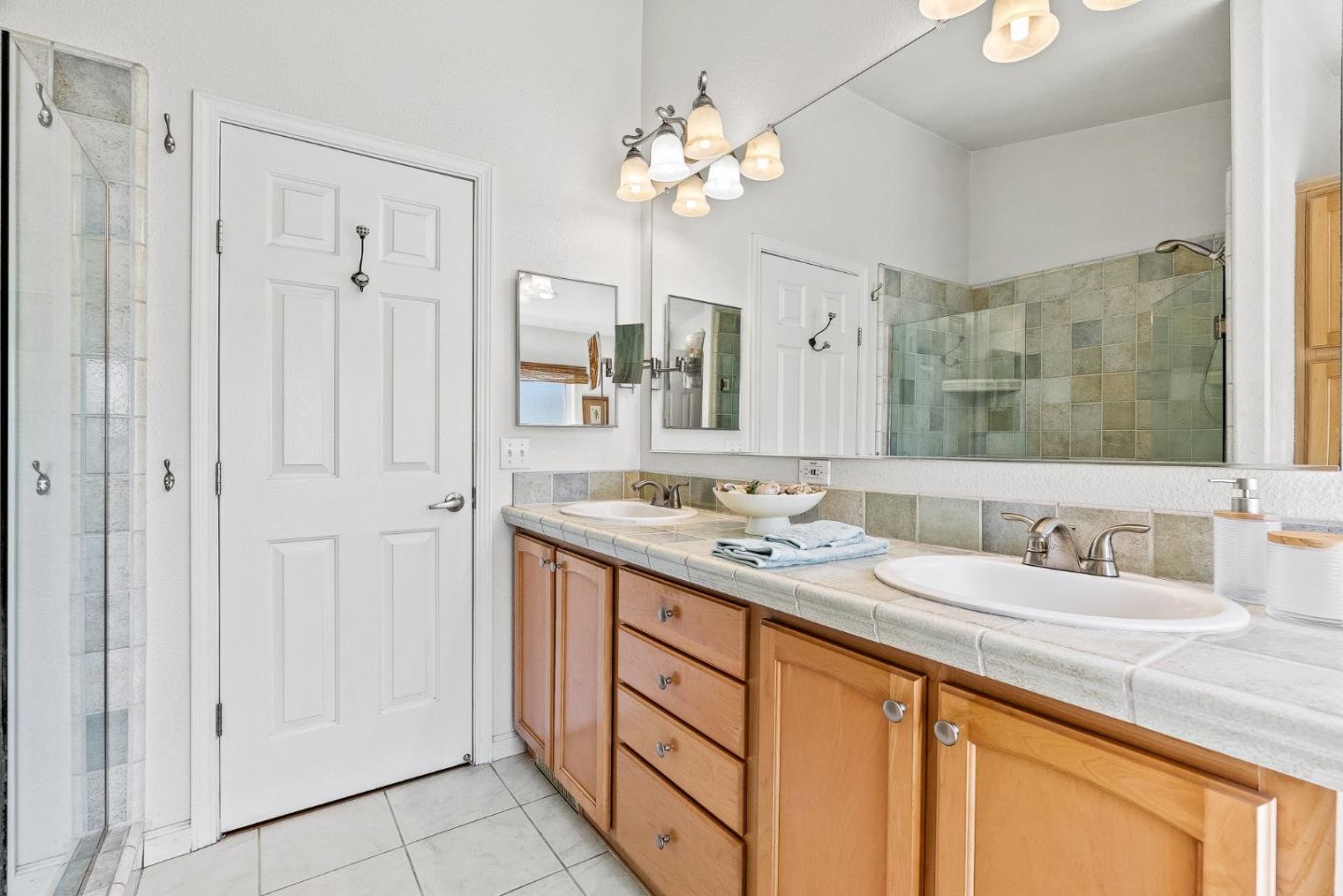 2155 Wharf Road, Unit 9 Capitola, CA 95010 - Photo 18 of 27 a bathroom with a double vanity sink mirror and