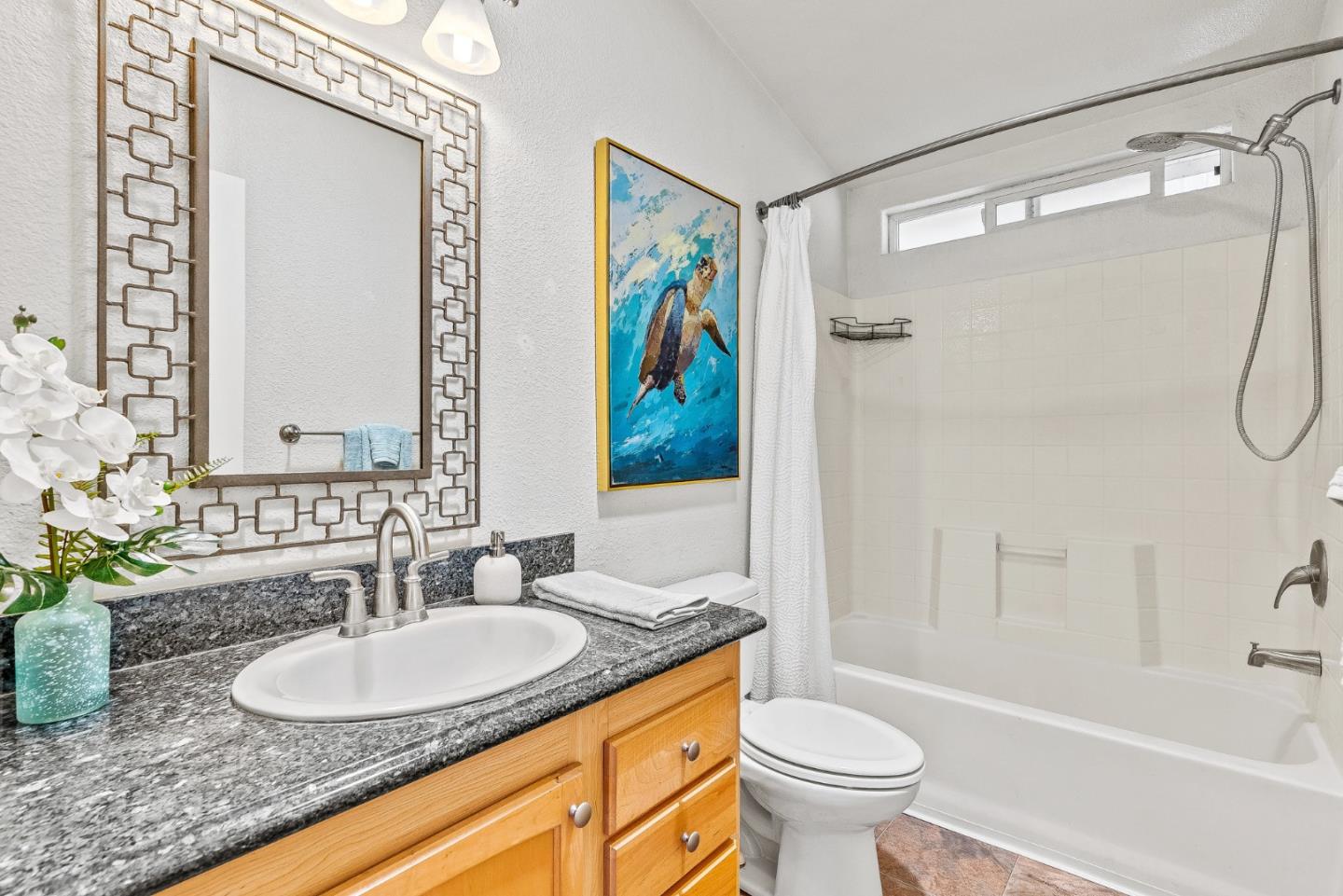 2155 Wharf Road, Unit 9 Capitola, CA 95010 - Photo 23 of 27 a bathroom with a granite countertop sink toilet and shower