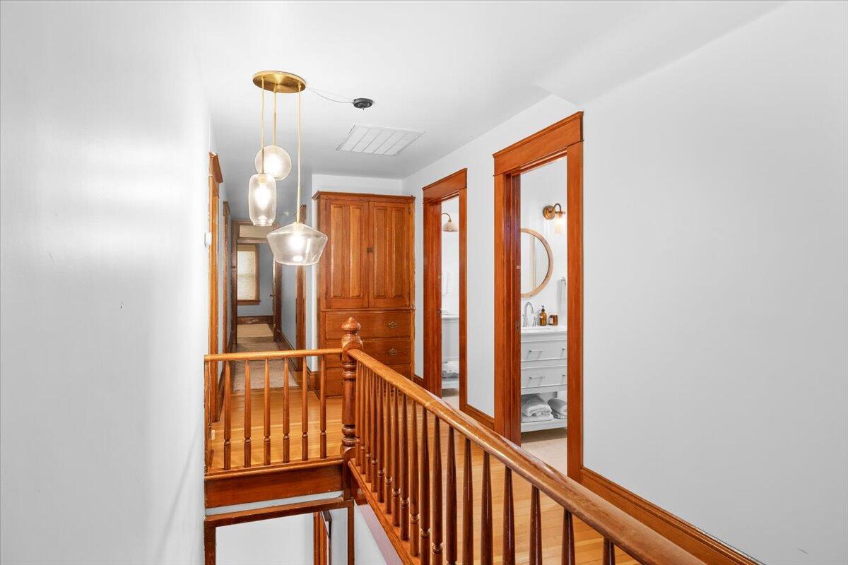 139 Southwest I Street Grants Pass, OR 97526 - Photo 30 of 47 a view of a hallway with wooden floor and windows