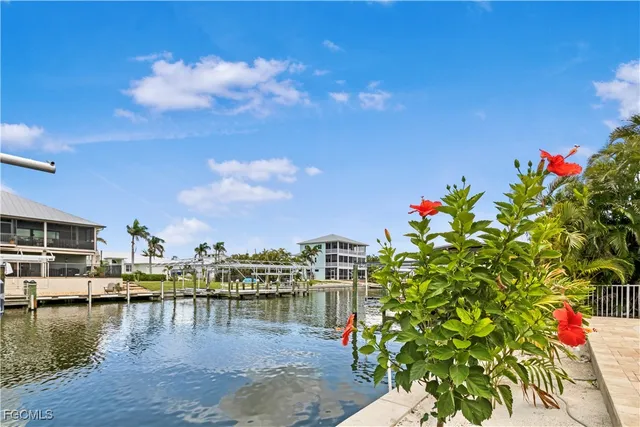 a kitchen with stainless steel appliances white cabinets and a stove top oven