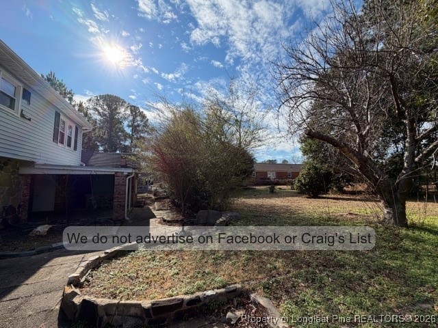 563 Alleghany Road Fayetteville, NC 28304 - Photo 14 of 15 a view of backyard with large trees