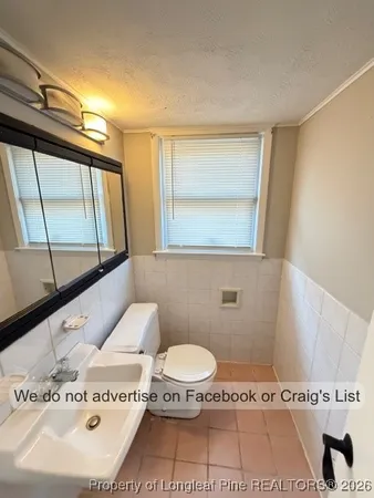 a bathroom with a tub and a sink