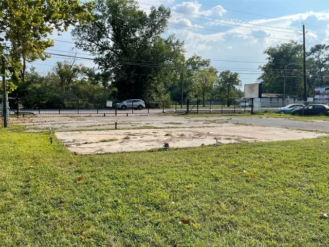 a view of a swimming pool with a yard