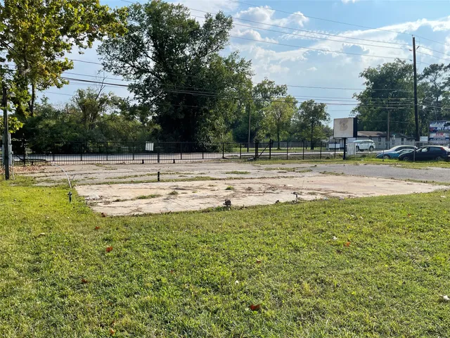 a view of a swimming pool with a yard