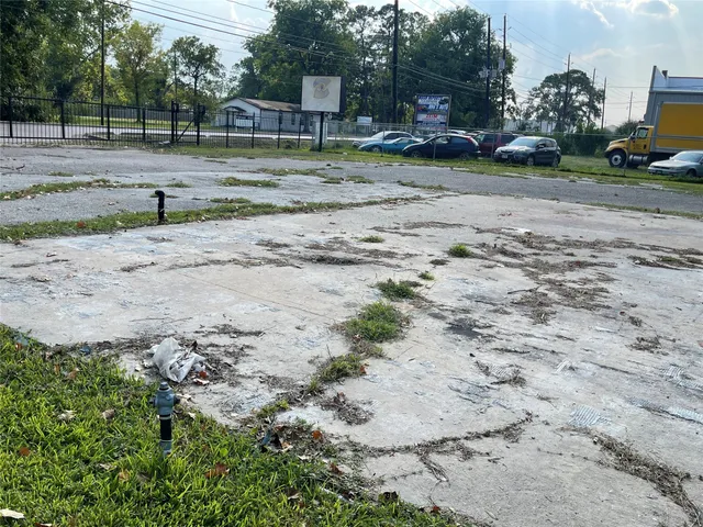 a view of a yard with swimming pool