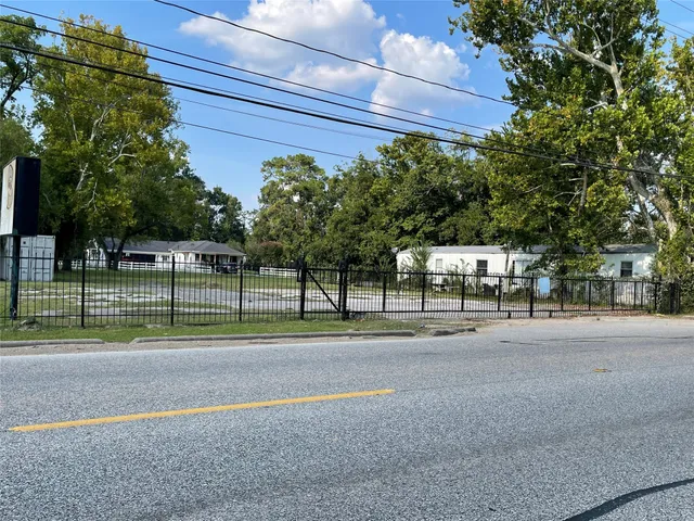 a view of a road with a building in the background