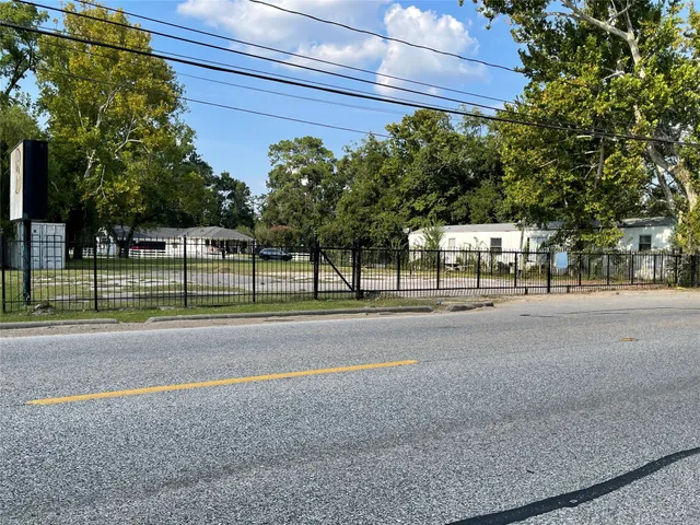 a view of a road with a building in the background