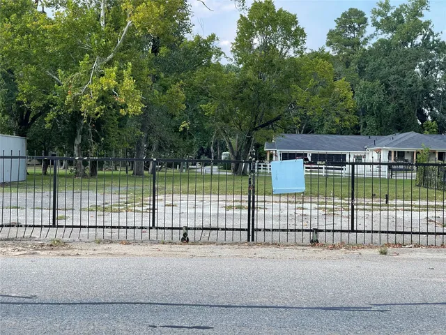 a view of a yard with a fence