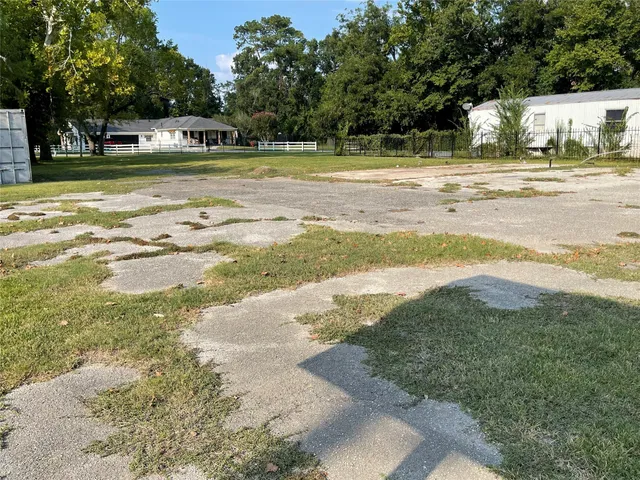a view of a swimming pool with a yard